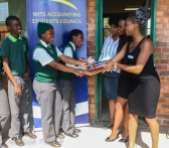 The Wits Accounting Student Council (ASC) handed over calculators and gave a few words of encouragement to disadvantaged learners in Zola, Soweto. Grade 11 accounting students accepting calculators from ASC’s chairperson Sewela Makgolane and Social Development office Siphindile Gumede with Miss Magagula.
